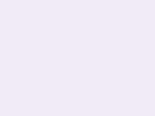 A flat, solid background featuring a soft and uniform shade of very pale lavender.